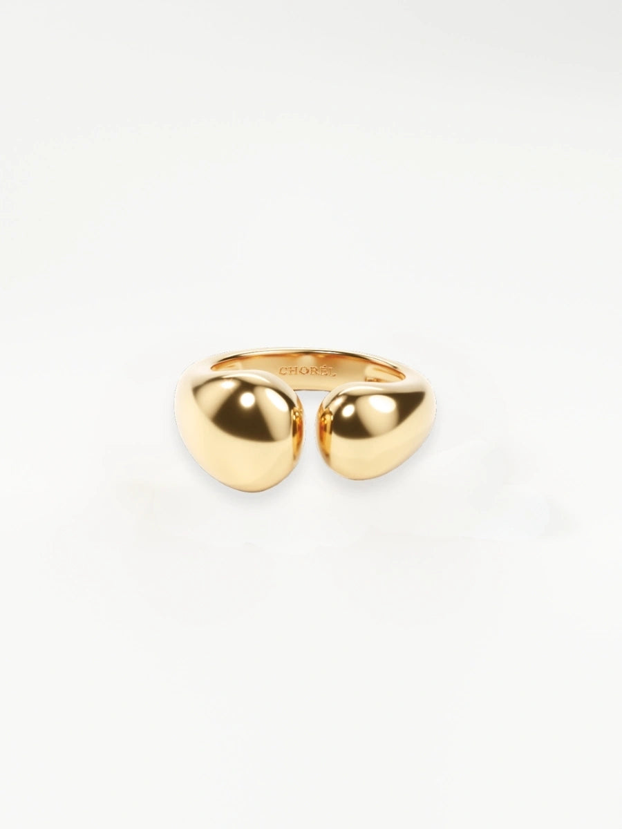 Gold ring with a unique design on a white background
